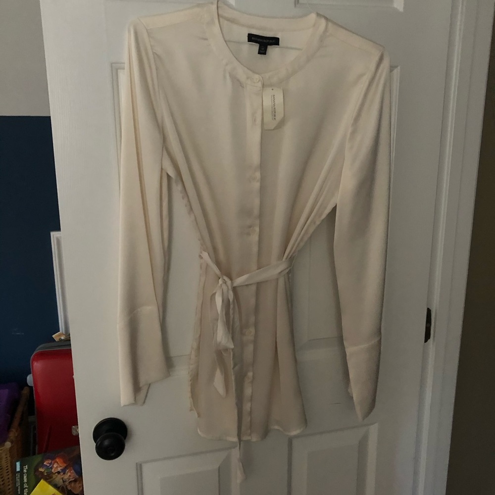 Cream belted blouse. Flared sleeves